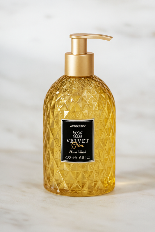 Gold bottle of Wonderin Velvet Glow Hand Wash on a light background